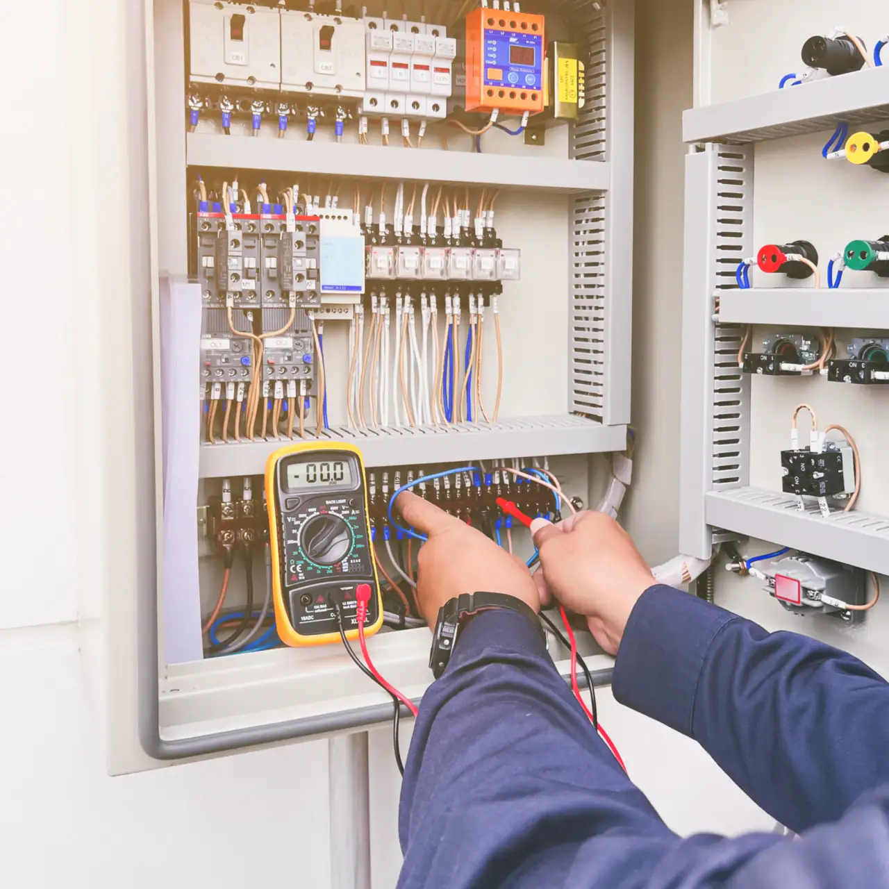 Homeowner checking a breaker panel during a power loss