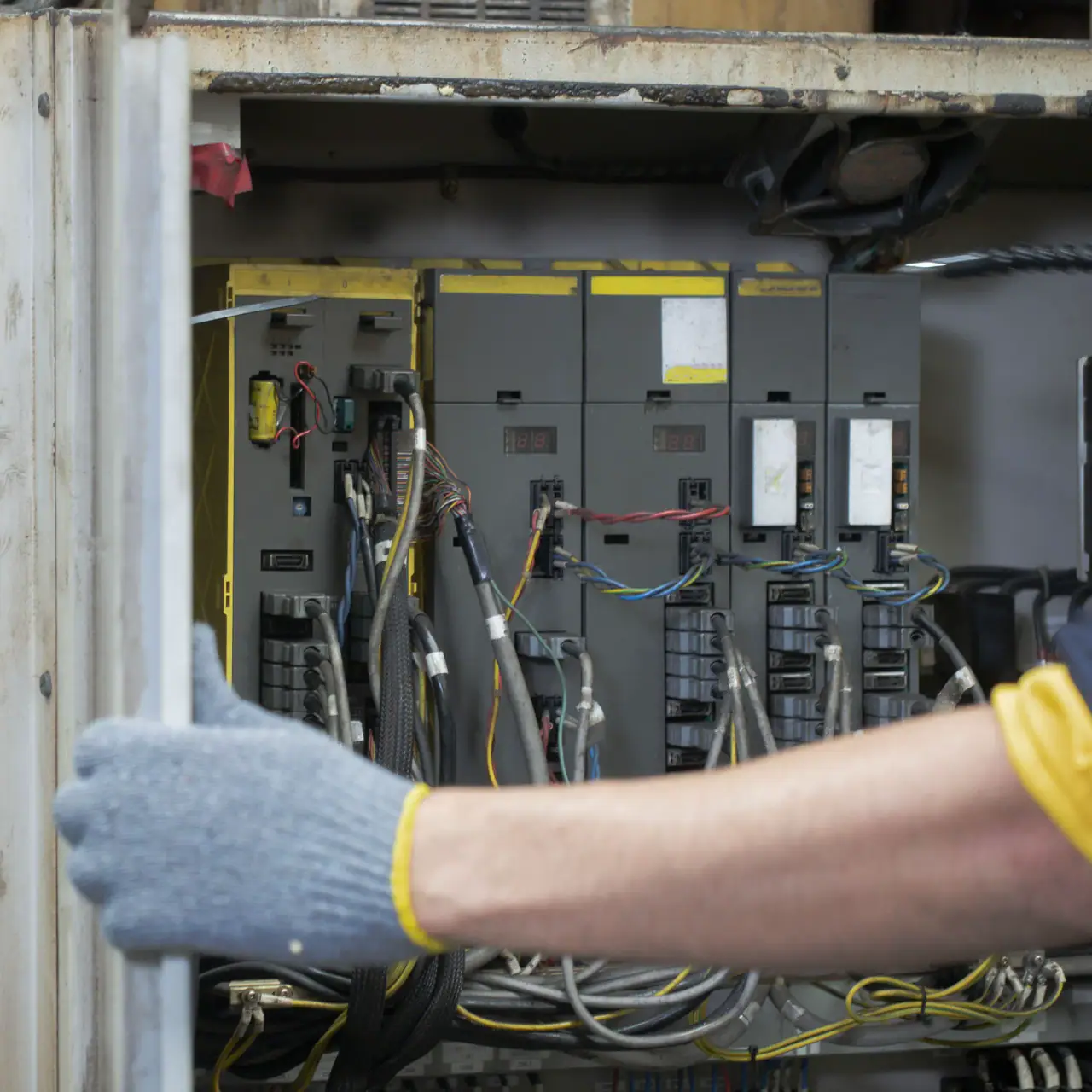 Electrician working on a breaker panel